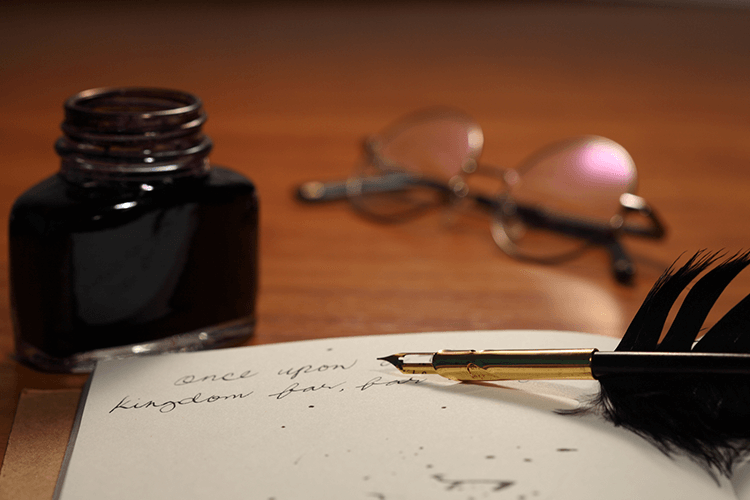 An Antique Quill Pen and Paper