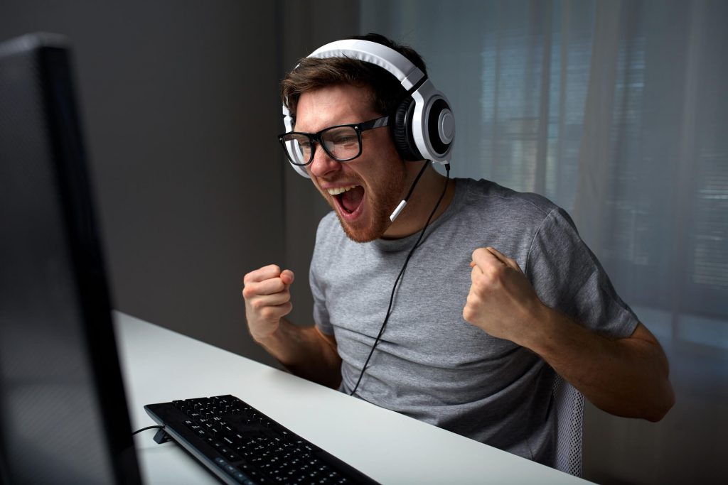 young man playing computer game